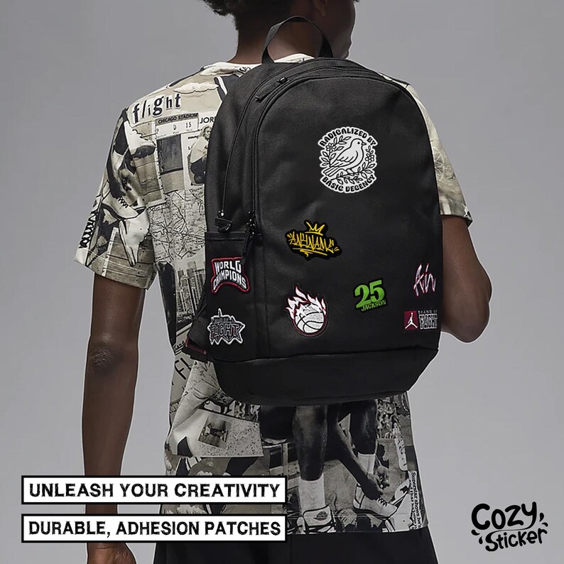 May include: Black backpack adorned with various patches featuring text and graphics, including a bird, basketball, and the number 25. The backpack has a side pocket. The image includes the text: "UNLEASH YOUR CREATIVITY, DURABLE, ADHESION PATCHES."