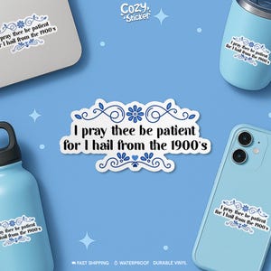 May include: A white sticker with the text "I pray thee be patient for I hail from the 1900's" in a decorative font, surrounded by blue floral designs. The sticker is displayed on a laptop, phone, and water bottle.