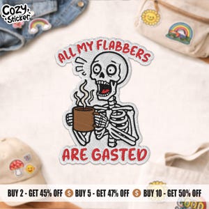 May include: Embroidered patch featuring a skeleton holding a brown mug, with the text "ALL MY FLABBERS ARE GASTED" in red. The patch has a white background and black outline. The patch is a fun, quirky accessory.
