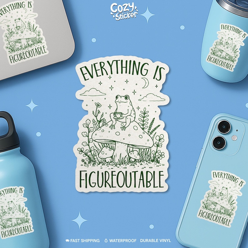 May include: A white sticker with a green illustration of a frog sitting on a mushroom, holding a cup. The sticker has the text "EVERYTHING IS FIGUREOUTABLE" in green. The image also shows the sticker on a laptop, a phone, and a tumbler.