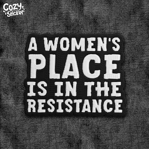 May include: Black and white embroidered patch with the text "A WOMEN'S PLACE IS IN THE RESISTANCE". The patch is rectangular with a black background and white lettering. The Cozy Sticker logo is in the upper left corner.