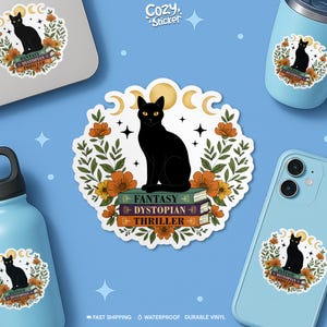 May include: A black cat sticker with yellow eyes, sitting atop a stack of books with the words "Fantasy Dystopian Thriller." The sticker is surrounded by orange flowers, green leaves, and crescent moons. The sticker is on a blue background.