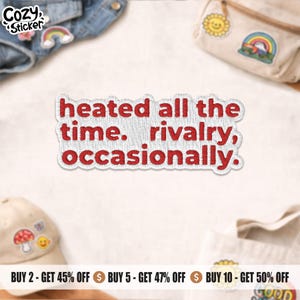 May include: An embroidered patch with the text "heated all the time. rivalry, occasionally." in red on a white background. The patch is surrounded by other patches and accessories.