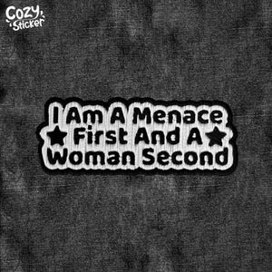 May include: Black and white embroidered patch with the text "I am a menace first and a woman second" and two white stars.
