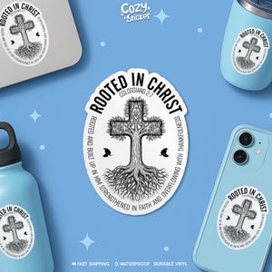 May include: Oval sticker with the text "Rooted in Christ" surrounding a cross-shaped tree design. The sticker also includes the text "Colossians 2:7" and "Rooted and built up in Him strengthened in faith and overflowing with thankfulness."