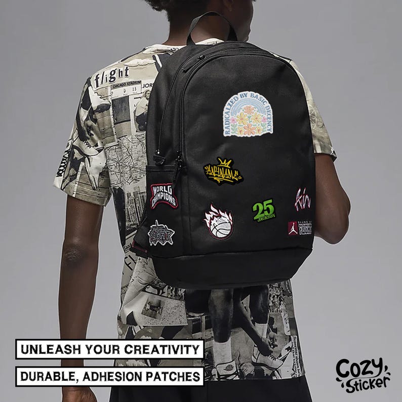 May include: Black backpack decorated with various patches featuring floral, basketball, and text designs. The backpack has a side pocket and is viewed from behind. The image includes the text "UNLEASH YOUR CREATIVITY" and "DURABLE, ADHESION PATCHES."