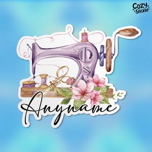 May include: A purple vintage sewing machine with a wooden handle and pink flowers. The machine is on a wooden table with spools of thread and a pair of scissors. The text "Anyname" is written below the machine.