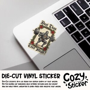 May include: A die-cut vinyl sticker showing a knight weightlifting, surrounded by roses and the words "Dost Thou Even Hoist?". The sticker is placed on a laptop, with the Cozy Sticker logo visible.