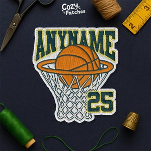 May include: Embroidered basketball patch with the text "ANYNAME" above an orange basketball going through a net. The number "25" is below the net. The patch has a green and yellow border.