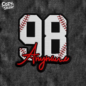 May include: White baseball jersey patch with the number 98 and red stitching. The name "Anyname" is written in red cursive below the number.