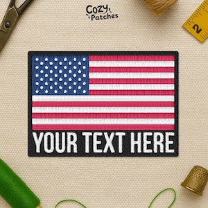 May include: Embroidered patch featuring the American flag design with red and white stripes and a blue field of white stars. The patch has a black border and the text "YOUR TEXT HERE" in white.