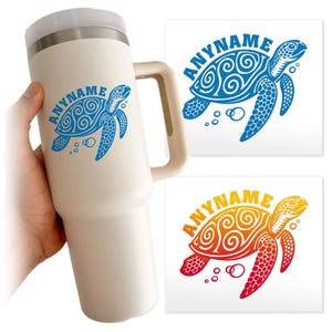 May include: A cream-colored insulated tumbler with a handle, featuring a blue sea turtle design and the word "ANYNAME". Two additional sea turtle designs in blue and orange-red are also shown.