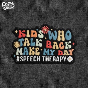 May include: A black embroidered patch with the text "KIDS WHO TALK BACK MAKE MY DAY #SPEECH THERAPY" in colourful, stitched letters. The patch has a black border and decorative floral accents.