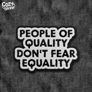 May include: A black and white patch with the text "PEOPLE OF QUALITY DON'T FEAR EQUALITY". The patch has a white border and is on a dark gray denim background. The words are in a bold, sans-serif font.