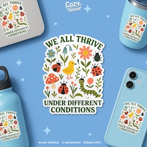 May include: A sticker with a colorful illustration of a yellow bird, ladybugs, flowers, and a caterpillar. The sticker has the text "WE ALL THRIVE UNDER DIFFERENT CONDITIONS". The image also shows the sticker on a laptop, a phone, and a water bottle.