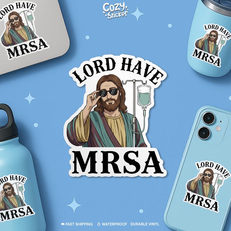 May include: A sticker featuring an illustration of Jesus wearing sunglasses and an IV drip, with the words "LORD HAVE MRSA". The sticker is surrounded by other stickers and items with the same design. The background is light blue.