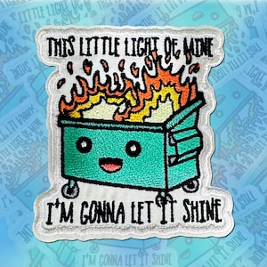 May include: White embroidered patch with a blue dumpster with a smiling face and flames coming out of the top. The text "This Little Light of Mine" is above the dumpster and "I'm Gonna Let It Shine" is below the dumpster.
