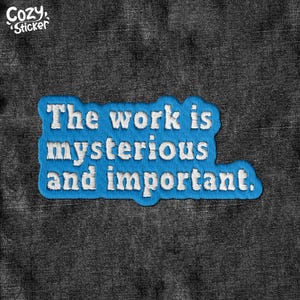 May include: Blue embroidered patch with white text that reads "The work is mysterious and important."
