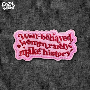 May include: A pink embroidered patch with the text "Well-behaved women rarely make history" in red script. The patch has a light pink border and small heart details. The word "Cozy Sticker" is in the upper left corner.