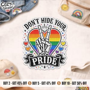 May include: Embroidered patch with the text "DON'T HIDE YOUR PRIDE" and a skeleton hand making a peace sign. The patch features a rainbow heart and the word "PRIDE" on a banner. Small rainbow hearts surround the main design.