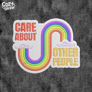 May include: Embroidered patch with the text "CARE ABOUT OTHER PEOPLE" in red and yellow, with a rainbow design. The patch has a white border and is set against a dark gray denim background.