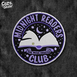 May include: Circular embroidered patch with the text "MIDNIGHT READERS CLUB" in purple. The design features an open book, a crescent moon, stars, and the words "ONE MORE CHAPTER". The patch has a black background and a purple border.