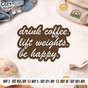 May include: A brown embroidered patch with the text "drink coffee. lift weights. be happy." in white. The patch has a wood grain texture and a white border. The image also shows other patches and accessories.