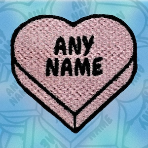 May include: Pink heart-shaped candy patch with black outline and the text "ANY NAME" in black.