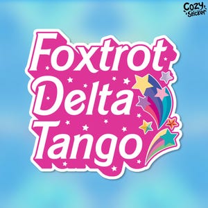 May include: Pink sticker with white text that reads "Foxtrot Delta Tango" with rainbow stars and streaks.