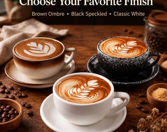 May include: Three ceramic coffee cups with saucers, each filled with latte art. The text reads: Choose Your Favorite Finish, Brown Ombre, Black Speckled, Classic White. The cups feature distinct finishes: a brown ombre, a black speckled, and a solid white.