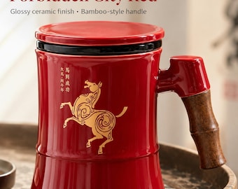 May include: A glossy red ceramic mug with a lid, featuring a gold horse illustration and Chinese characters. The mug has a dark brown bamboo-style handle. Text on the mug reads Forbidden City Red, Glossy ceramic finish, Bamboo-style handle.