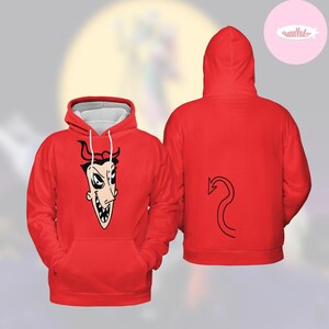 May include: Red hoodie with a devil cartoon graphic on the front and a black tail design on the back. The hoodie has a white-lined hood and a front pocket. The devil graphic features a black outline with a white face and teeth.