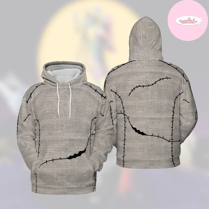 May include: A light gray hoodie with a textured fabric design. The hoodie features black stitching details and a front pocket. The hood has a white lining and white drawstrings. The back of the hoodie also has black stitching.