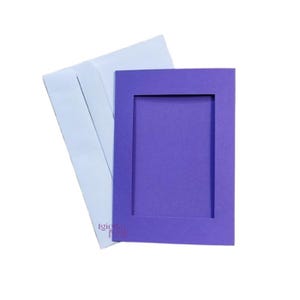 May include: A purple card with a white envelope. The card has a rectangular opening in the center.