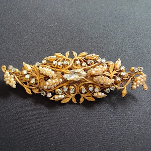 Gold tone metal brooch, Miriam Haskell