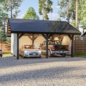 May include: A modern carport with a black corrugated metal roof and dark wood supports. A white electric car and a gray pickup truck are parked inside. The carport is on a gravel driveway, surrounded by trees and a wooden fence.
