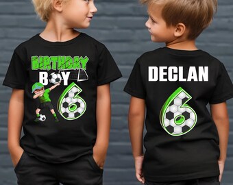May include: Black t-shirts with soccer-themed graphics. One shirt features "BIRTHDAY BOY" and a soccer player graphic with the number 6. The other shirt has the name "DECLAN" and the number 6 on the back.