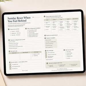May include: A digital tablet displaying a Sunday Reset planner template with sections for choosing reset levels, identifying difficulties, and organizing tasks. The layout features checkboxes, numbered lists, and text fields in a clean, organized format.