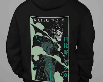 May include: Black hoodie featuring a graphic of a monster with a skull-like face, set against a backdrop of green mist. The text "KAIJU NO-8" is above the image, with Japanese characters to the right. The design is centered on the back of the hoodie.