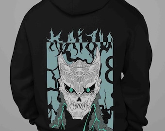 May include: Black hooded sweatshirt featuring a detailed illustration of a skull-like creature with glowing green eyes. The design includes the word "KRAKEN" above the skull and a number "8" on a light blue background.