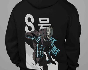 May include: Black hoodie featuring a graphic of a monster with the number "8" and Japanese text. The monster is depicted in shades of gray and blue, with a detailed design. The hoodie has a hood and a kangaroo pocket.