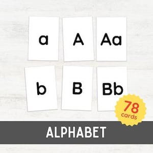 May include: Set of 78 alphabet flash cards with black letters on white cards. Each card features a lowercase letter, uppercase letter, and both letters together. The cards are arranged in three rows of six cards.