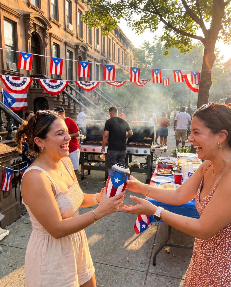 May include: A cylindrical beverage cooler featuring the Puerto Rican flag design with a white star on a blue triangle and red and white stripes. The cooler is held between two individuals outdoors during a street celebration with flags.