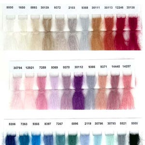 May include: A colour chart for Mohair Royal yarn, a blend of 80% kid mohair and 20% polyamide-nylon. The chart shows 25 gram skeins in a variety of colours, including white, beige, brown, pink, purple, blue, green, and black. The chart also includes the yarn weight (25 grams) and yardage (215 metres).