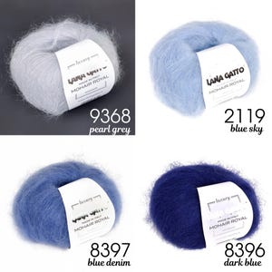 May include: Four skeins of Lana Gatto Mohair Royal yarn in different colours: pearl grey, blue sky, blue denim, and dark blue. Each skein is labelled with the brand name and the colour name.