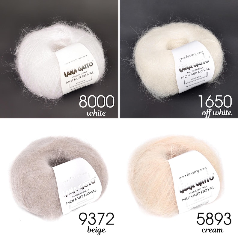 May include: Four balls of Lana Gatto Mohair Royal yarn in different colours: white, off white, beige, and cream. Each ball is labelled with the brand name, "Lana Gatto", and the yarn type, "Mohair Royal".