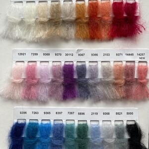 May include: A colour chart of mohair yarn samples with numbers and names. The yarn is a blend of mohair and nylon. The colours range from white to black, with shades of pink, purple, blue, green, and red.