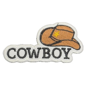 May include: White embroidered patch with the word "COWBOY" in black lettering and a brown cowboy hat with a yellow star above the brim.