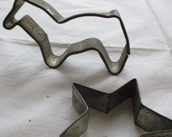 two antique cookie cutters