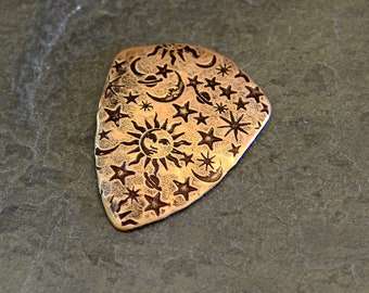 bronze guitar pick in shield shape with sun moon and stars - playable bronze guitar pick - NicisPicks